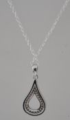 A silver an cz adorned pear shaped ladies pendant necklace chain. Total weight 3.