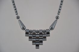 A vintage hermatite bib necklace with barrel screw clasp. Measures 18 inches.