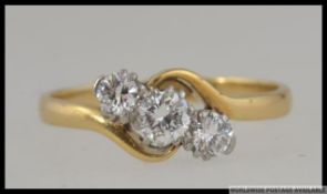 An 18ct gold and Platinum diamond trilogy ring set with three good diamonds a total of approx 50pts.