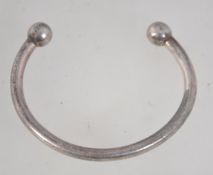 A heavy 925 silver cuff bangle bracelet with ball finial decoration. Marked 925. Weight 35g.