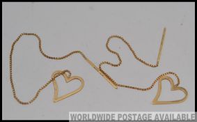 A pair of Italian 9ct gold heart chain drop earrings marked 375 Italy. Measures 11cms. Weight 1g.