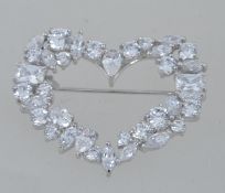 A 925 silver and CZ brooch pin in the for of a heart with roller clasp. Marked Tova 925 DQ CZ.
