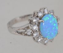 A ladies silver cz stone and blue opalite dress daisy head ring,