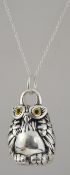 A wonderful large silver owl pendant and necklace chain. The large owl with glass eyes.