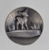 A vintage 1940's figural diorama pewter brooch pin of Bambi in the forest with foliate background