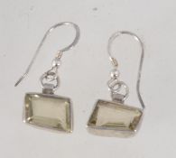 A pair of sterling silver and pale yellow topaz earrings set with unusual rhomboid shaped stones.