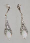 A stunning pair of silver and marcasite opal art deco style earrings of tapering form.