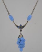 A vintage 1950s popcorn chain pendant necklace strung with a blue glass bead cluster in the form of