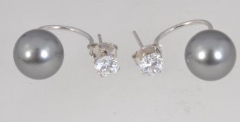 A pair of 925 silver designer grey freshwater pearl earrings with CZ studs and post backs.