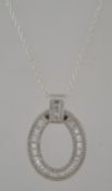A large silver and cz adorned hoop pendant and necklace chain,