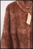 A vintage full length dark brown fur coa