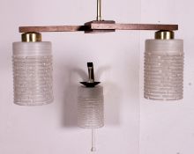 A 1960's teak and cylinder frosted glass