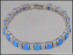 A silver CZ and opal bracelet