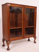 A 20th century 1930's glazed oak bookcas