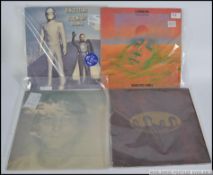 The Beatles - A collection of four vinyl