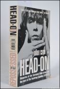 An original copy of Head On by Julian Co