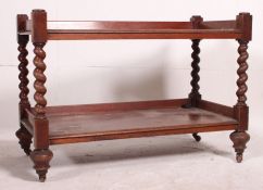 A Victorian mahogany barley twist two ti