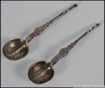 A pair of silver condiments spoons beari