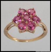 A hallmarked 9ct gold dress ring with ro