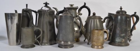 A collection of Victorian and other pewter wares to include part tea services , pint cups etc.