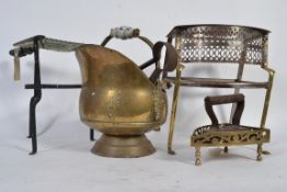 A collection of brass wares to include a coal scuttle an iron stand a various tools etc.