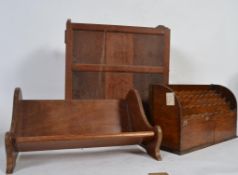 A Victorian solid oak book troth stand of slatted form along with a oak stationary tidy and a 19th