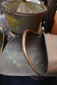 A group of copper preserve pans along with a coal scuttle