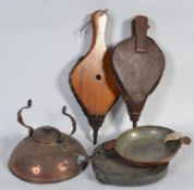 A pair of mahogany bellows along with a copper kettle ,