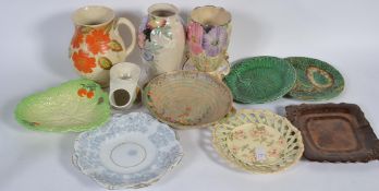 A group of studio pottery to include examples by Arthur Wood , Mailing ,