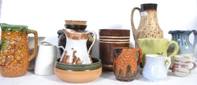 A collection of studio pottery jugs of various styles