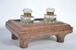 An early 20th Century glass and marble twin inkwell