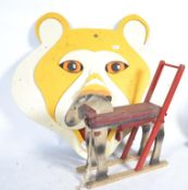 A group of items perfect for a childs nursery room to include a large sectional wooden bear face