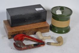 A hallmarked silver collared tobacco pipe in original case along with other pipes and some tobacco