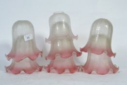 A set of 7 pink and clear glass lampshades