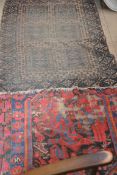 Two late 19th / early 20th century Persian style rugs,