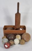 A collection of vintage sporting balls to include shot put , bowls ,