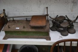 A vintage late 19th / early 20th century cast meatal industrial balance scales along with two