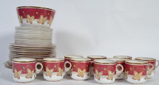 An early 20th Century 10 person part tea service in red autumn pattern (3518) consisting of 10