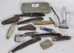 A collection of knives and razors to include some horn handled along with a white metal vesta case