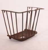 A large 19th century cast iron agricultural / industrial hay feeder of railed tapering form being