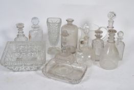A collection of cut glass decanters along with other cut glass wares
