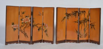 A pair of oriental miniature sectional room dividers / screens of matching forms with panels