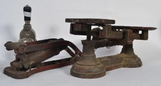 A vintage Duplex Kismet master foot pump along with a pair of 20th Century scales