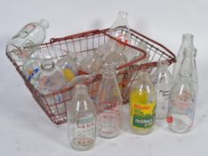 A collection of advertising milk bottles to include Crusha ,