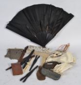 A silver white metal vintage mesh purse and other purses along with a group of vintage glove