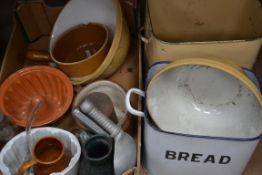 A collection of kitchenalia ro include Victorian jelly moulds , enamel bread bins ,