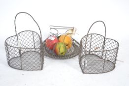 A 19th Century wire heart basket along with a metamorphic collapsible salad drainer