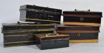 A good group of vintage cash / money box tins of different sizes most with inserts