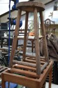A 20th century mahogany suitcase stand along with an Arts and Crafts stool a good 19th century cast