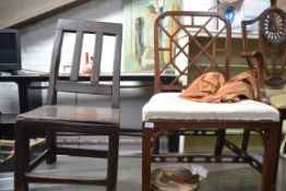 A Georgian hall / dining chair being constructed from oak along with a mahogany chair with a open